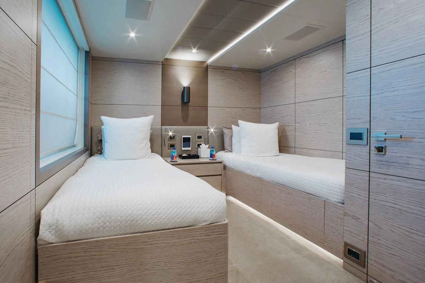 a room with two beds aboard COFINA Yacht for Sale