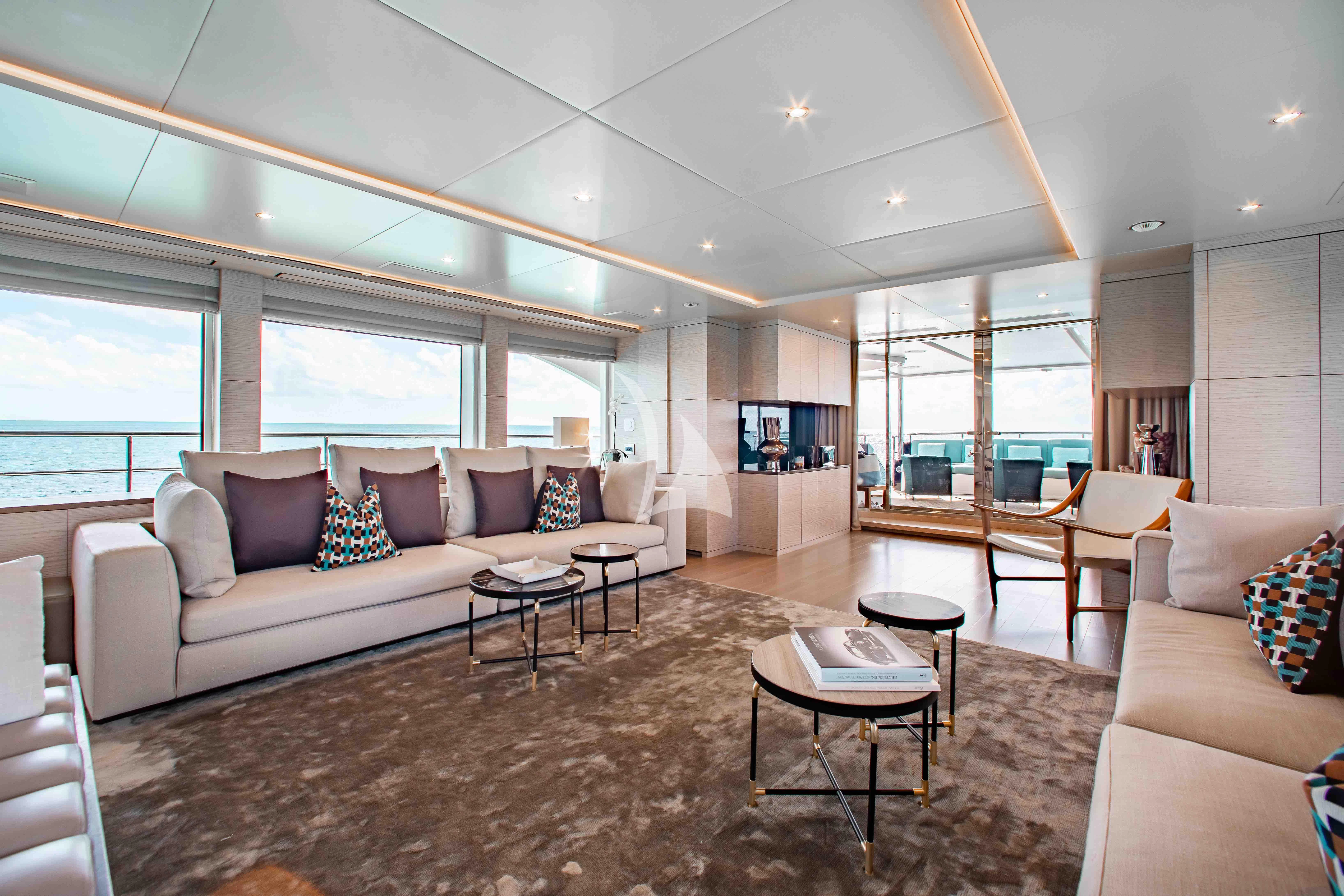 a living room with a couch and a table aboard COFINA Yacht for Sale