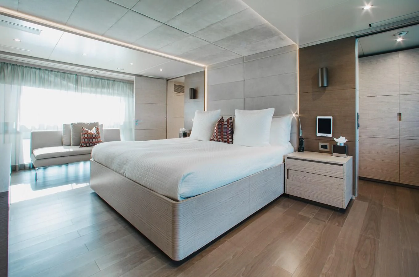 a large bedroom with a bed aboard COFINA Yacht for Sale