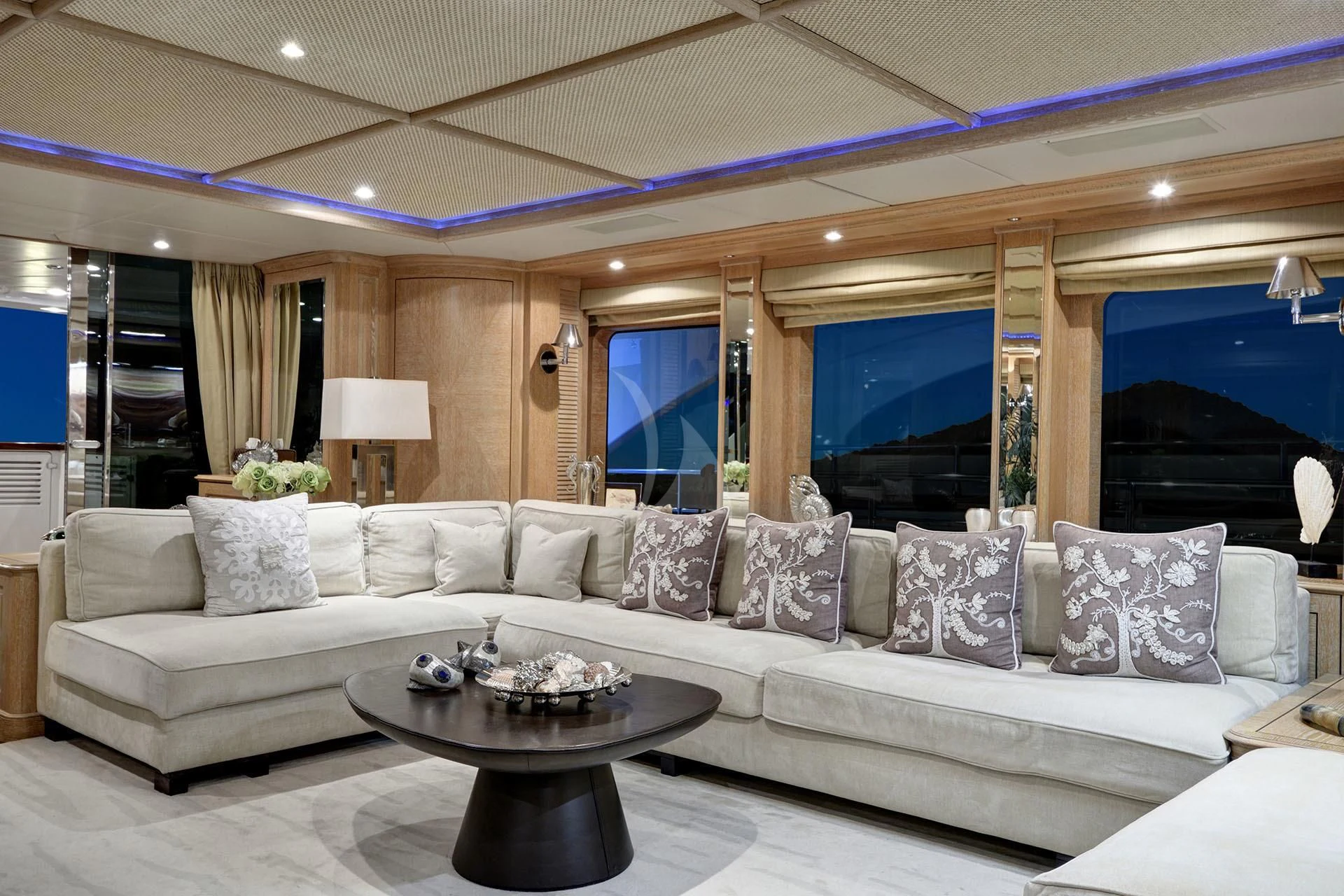 a living room with a large sofa aboard QUEST R Yacht for Sale