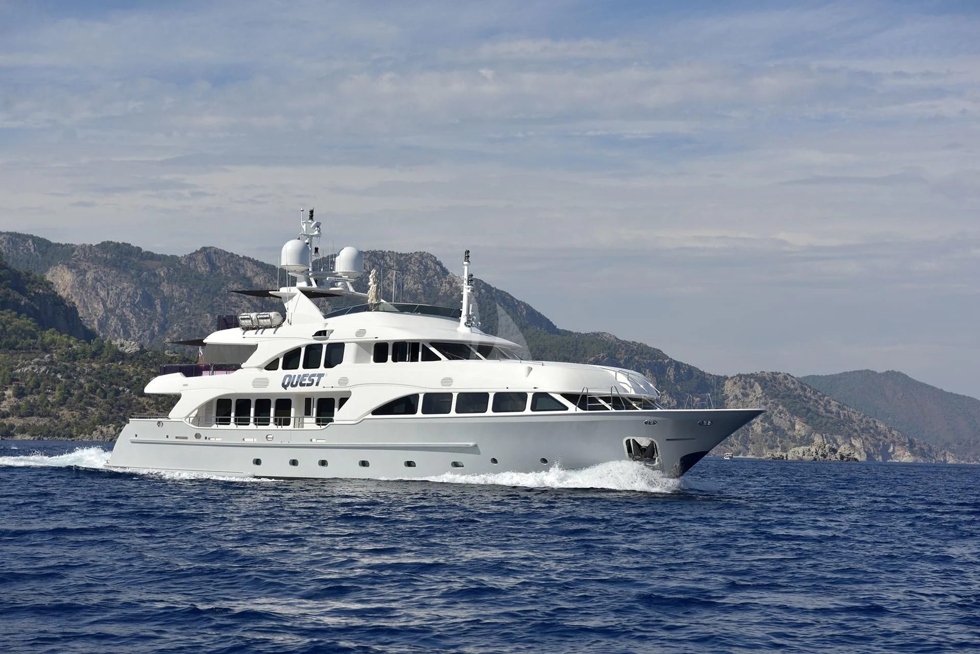 a white yacht in the water aboard QUEST R Yacht for Sale