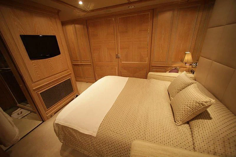 a bed in a room aboard QUEST R Yacht for Sale