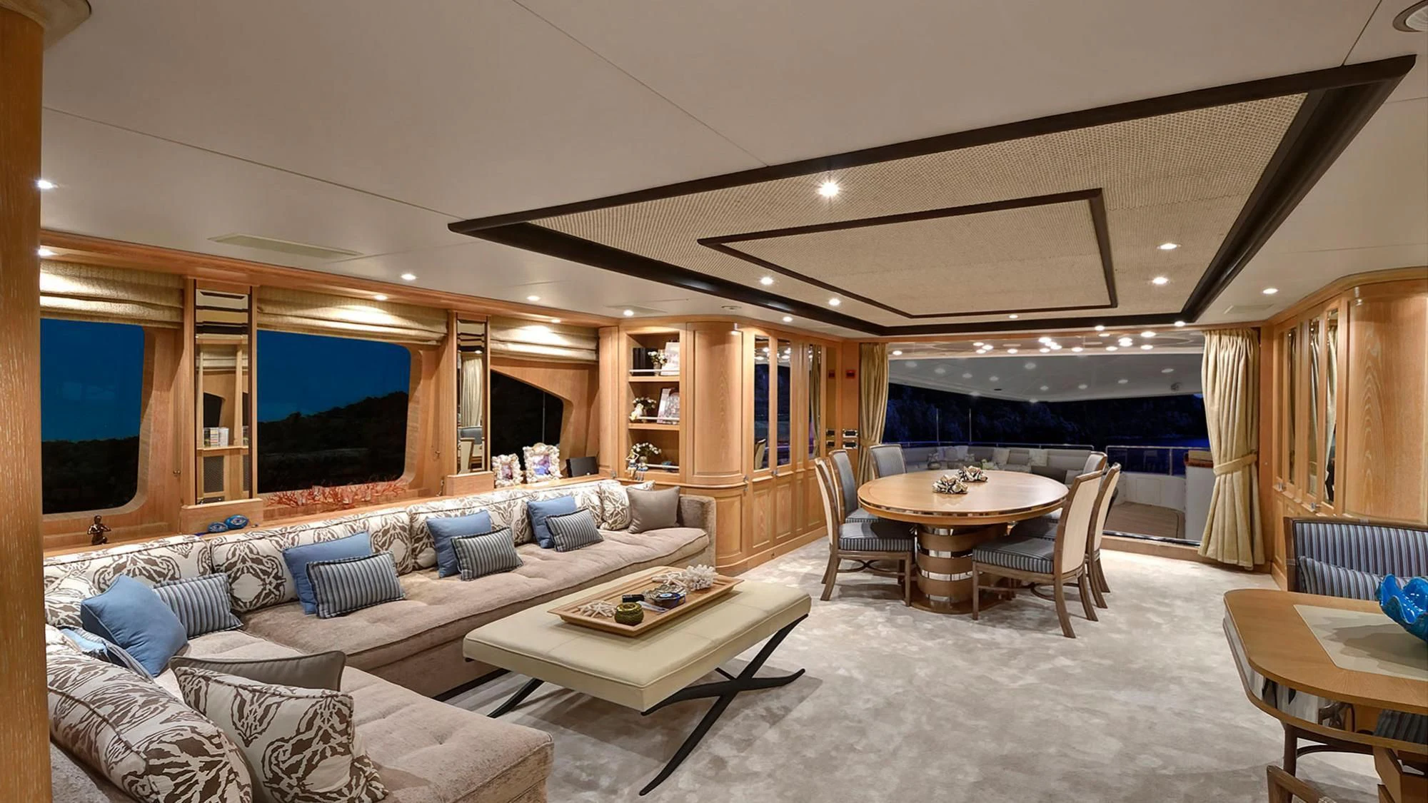 a living room with a large glass window aboard QUEST R Yacht for Sale