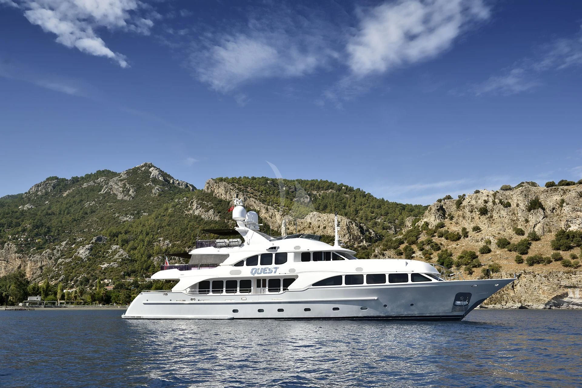 a white yacht in the water aboard QUEST R Yacht for Sale