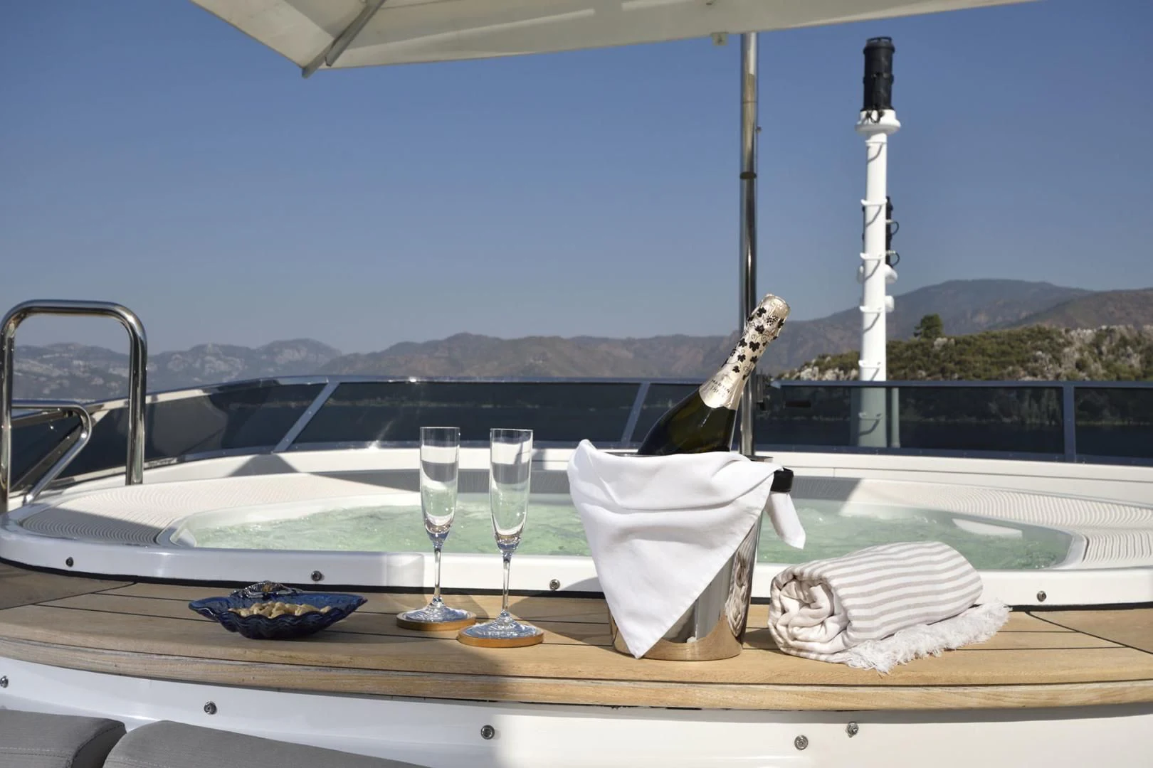 a champagne bottle on a table aboard QUEST R Yacht for Sale