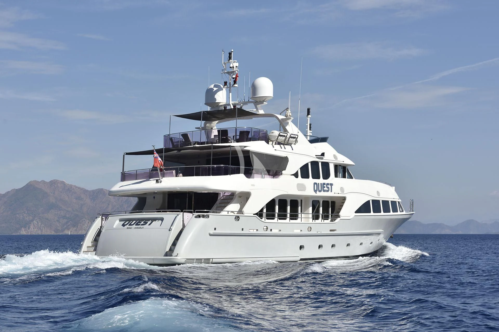 a white boat on the water aboard QUEST R Yacht for Sale