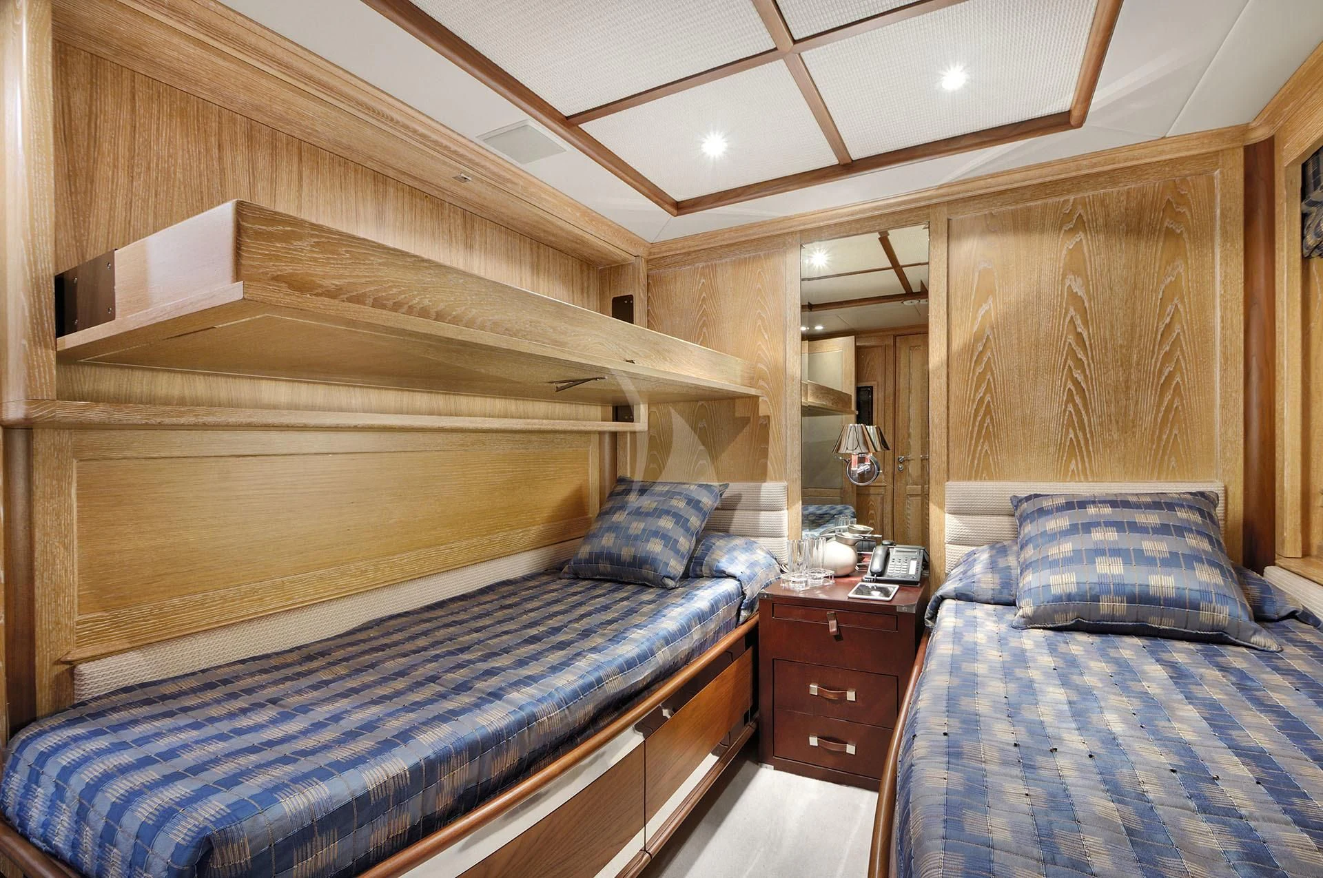 a bedroom with two beds aboard QUEST R Yacht for Sale