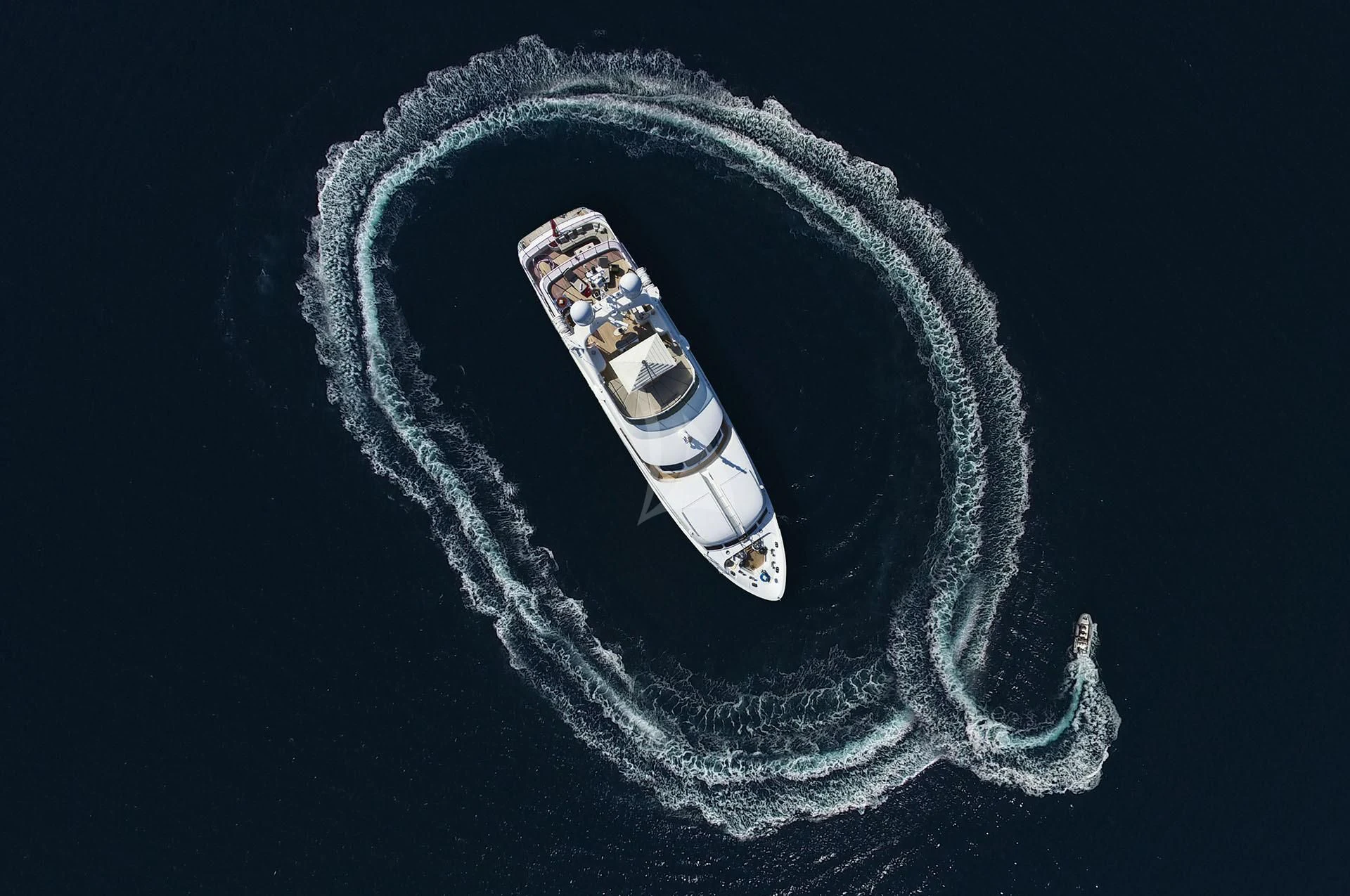 a black and white shirt with a silver logo on it aboard QUEST R Yacht for Sale