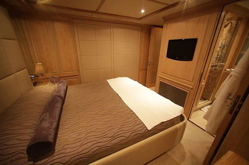 a bed in a room aboard QUEST R Yacht for Sale