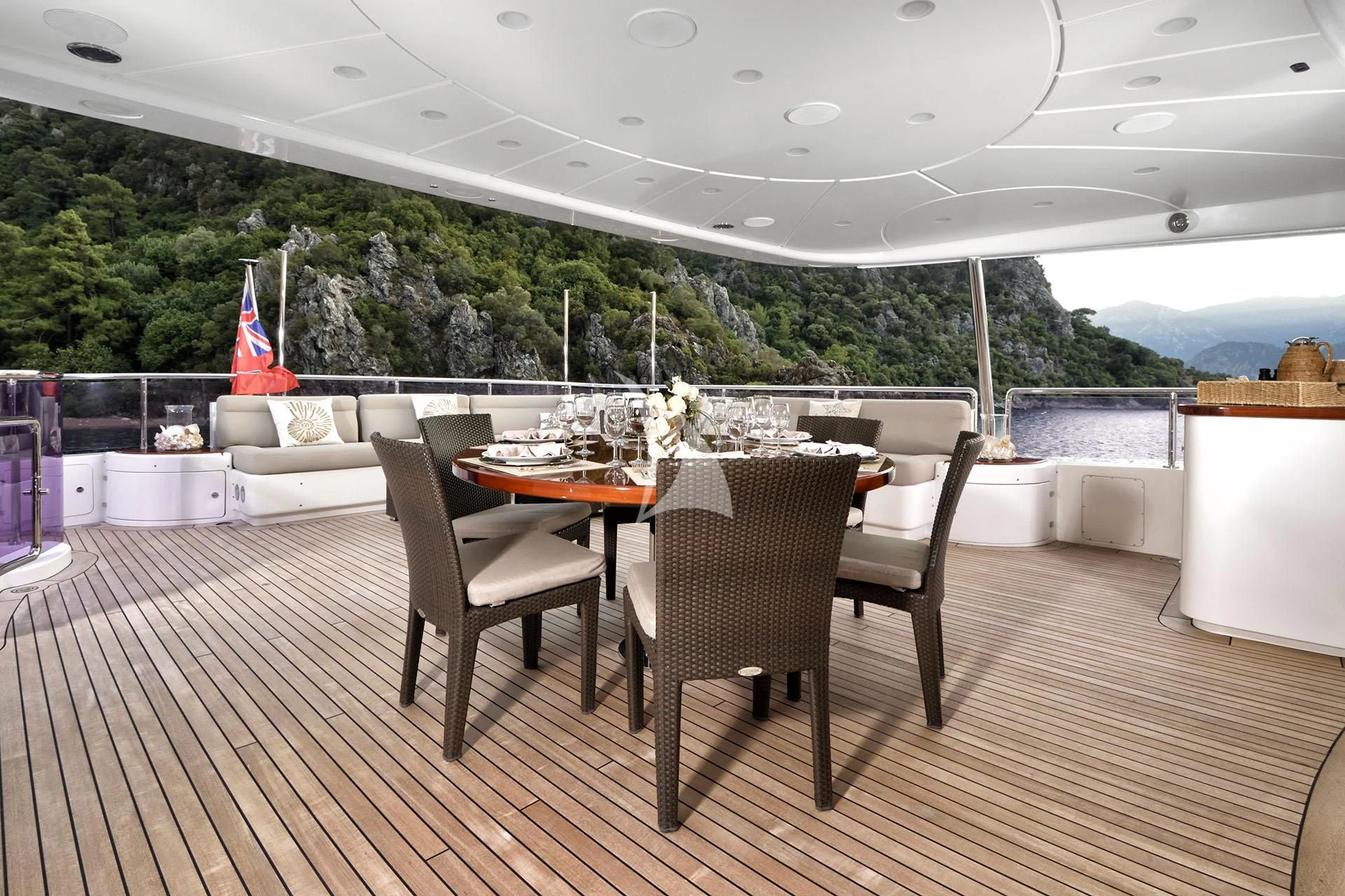 a table and chairs on a deck aboard QUEST R Yacht for Sale