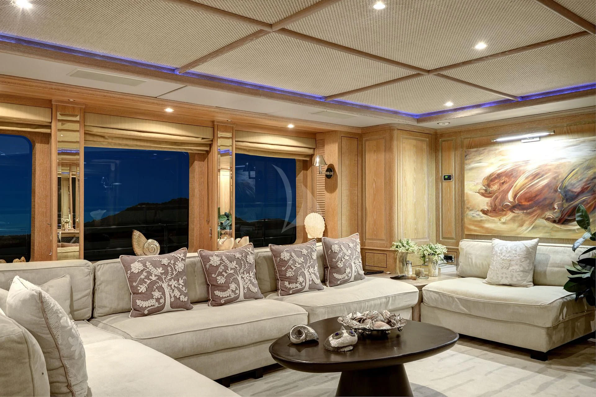 a living room with a large window aboard QUEST R Yacht for Sale