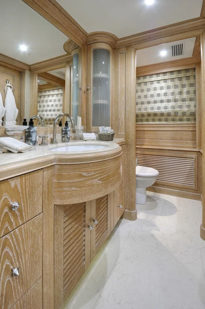 a bathroom with a sink and a toilet aboard QUEST R Yacht for Sale