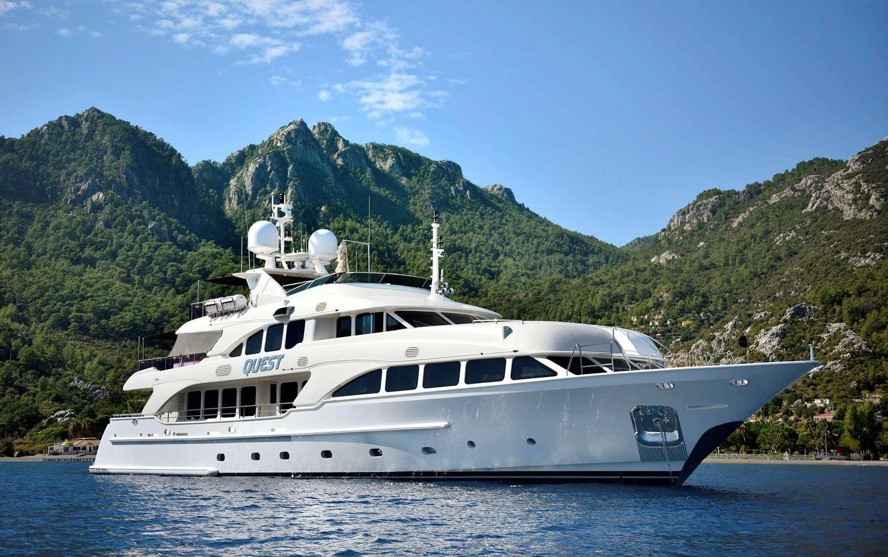 a white yacht in the water aboard QUEST R Yacht for Sale