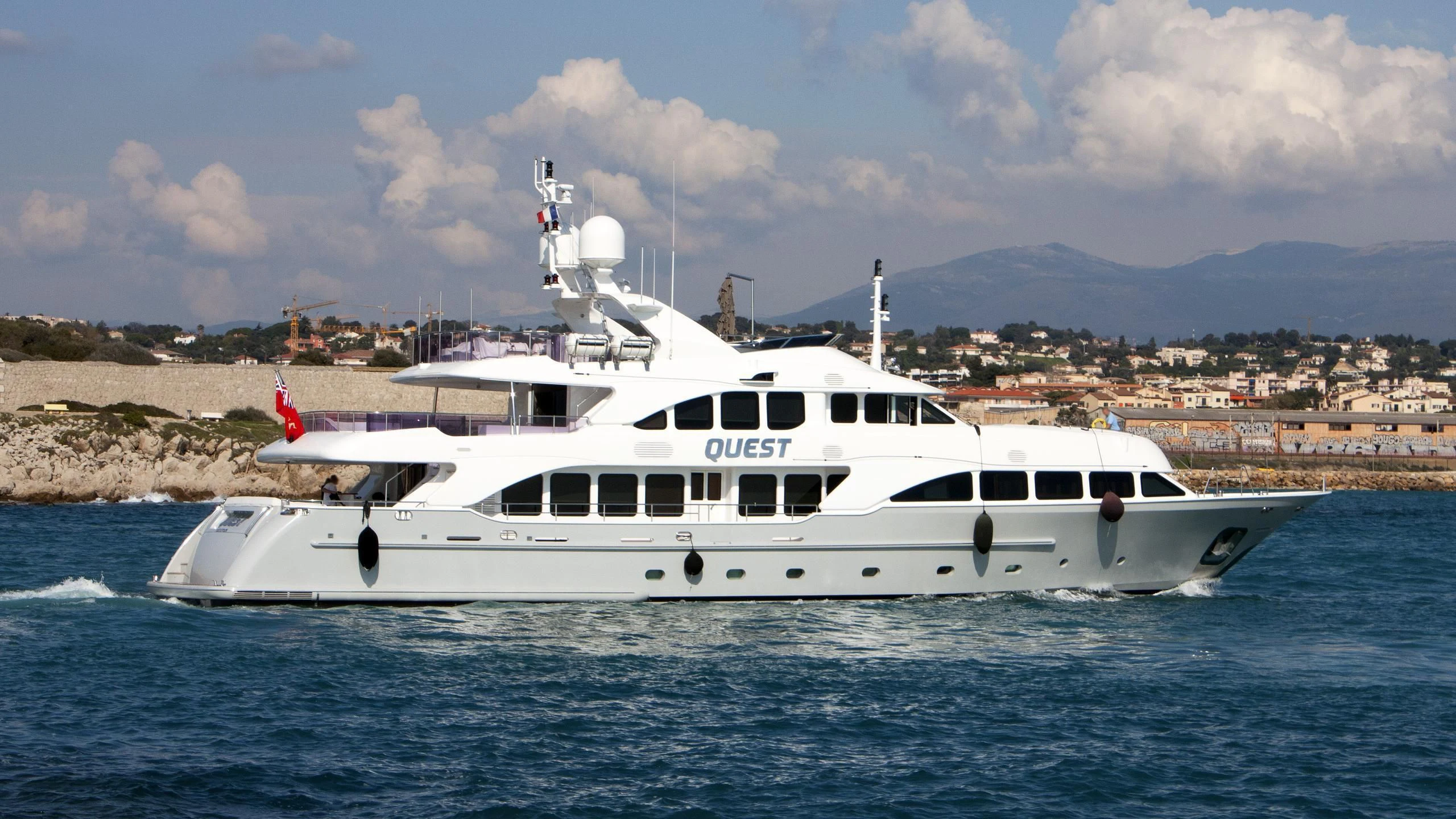 a white yacht in the water aboard QUEST R Yacht for Sale