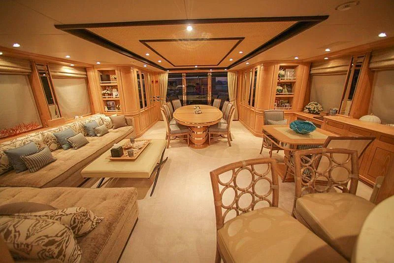 a living room with a couch and a table aboard QUEST R Yacht for Sale