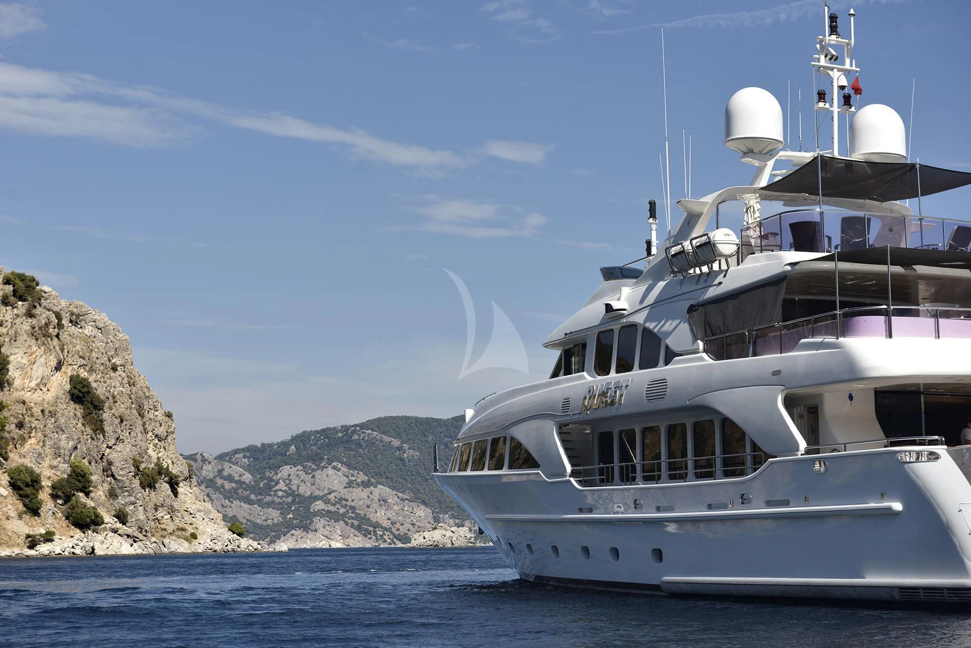a white yacht in the water aboard QUEST R Yacht for Sale