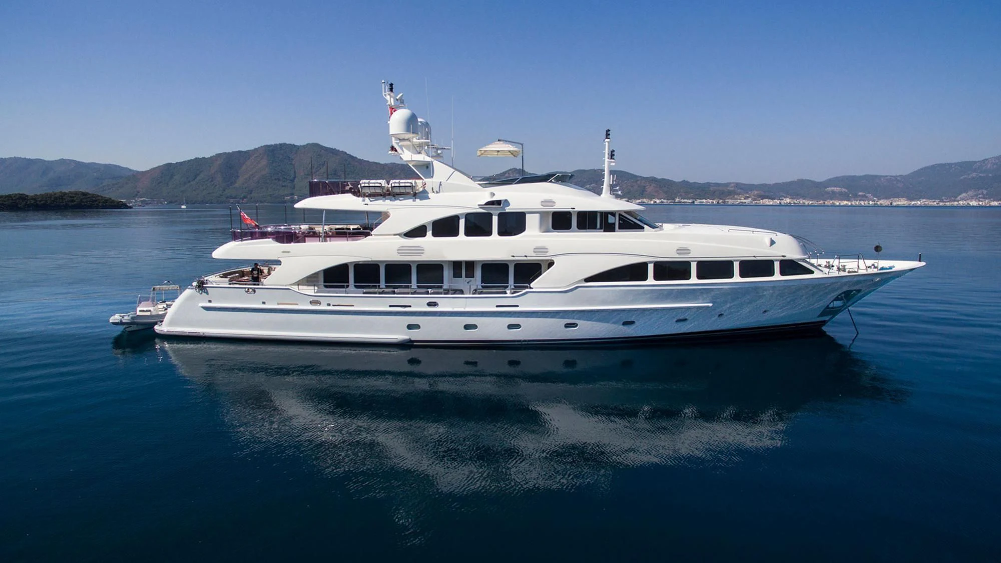 a white yacht in the water aboard QUEST R Yacht for Sale