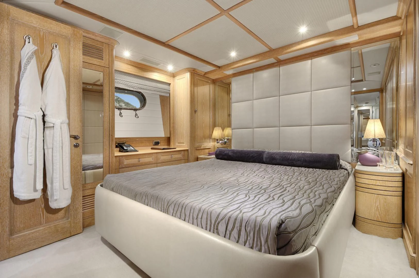 a hotel room with a large bed aboard QUEST R Yacht for Sale