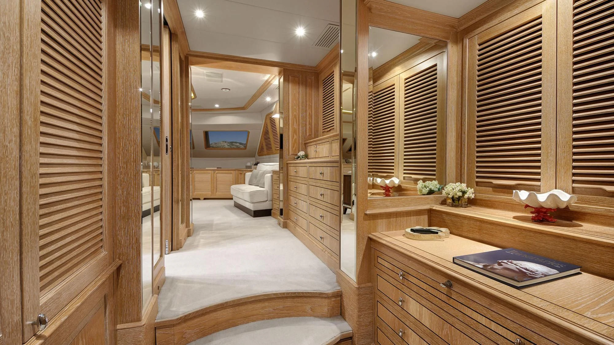 a room with a bed and desk aboard QUEST R Yacht for Sale