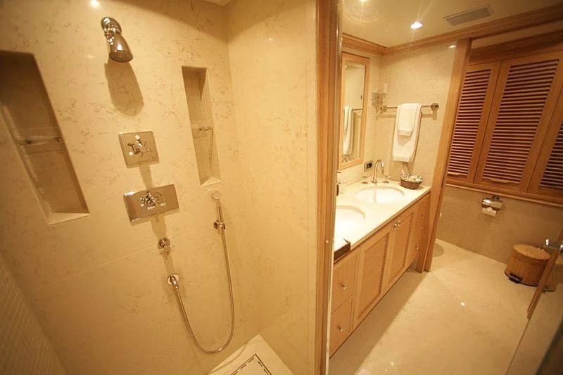 a bathroom with a shower and sink aboard QUEST R Yacht for Sale