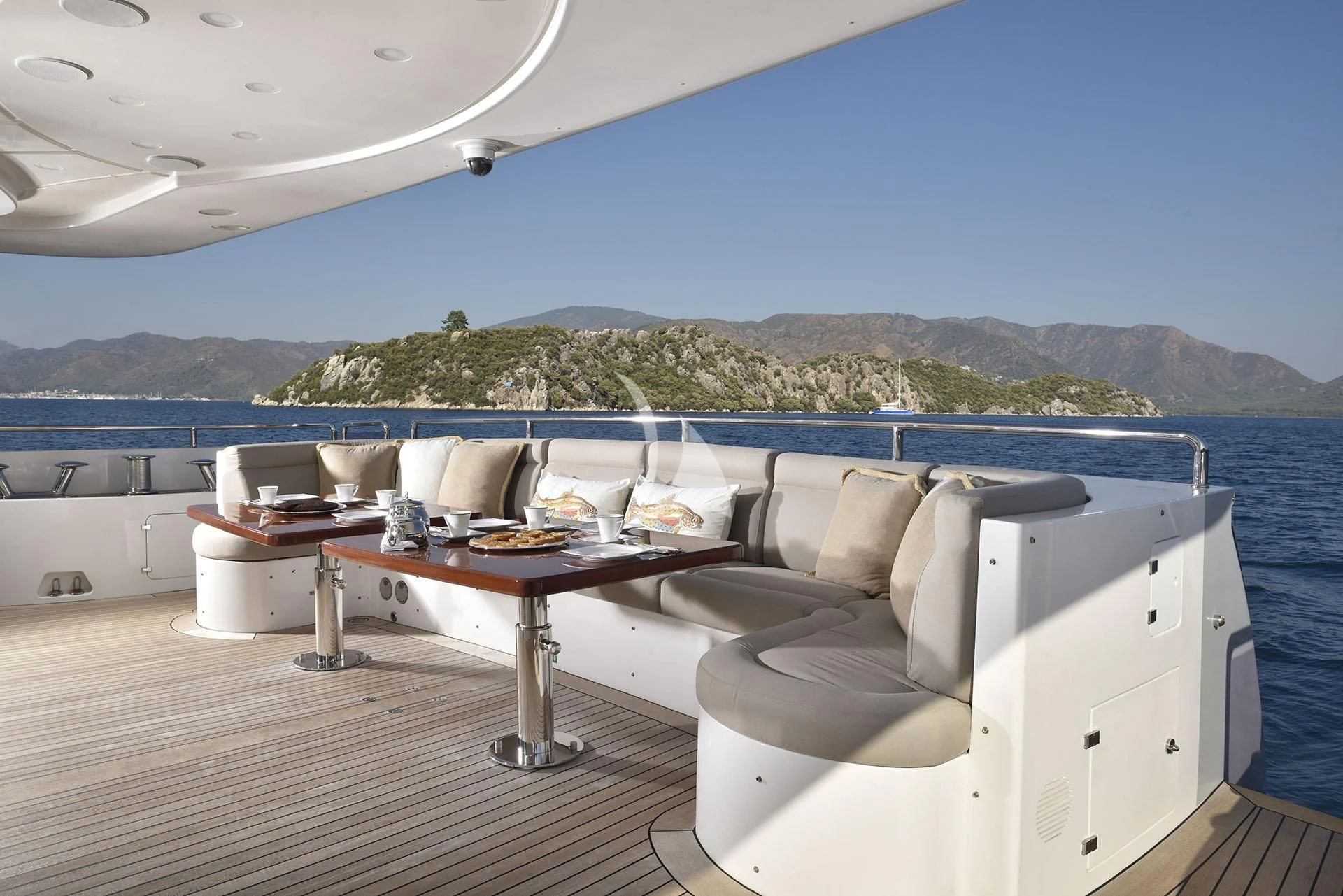 a lounge chair on a deck overlooking a large body of water aboard QUEST R Yacht for Sale