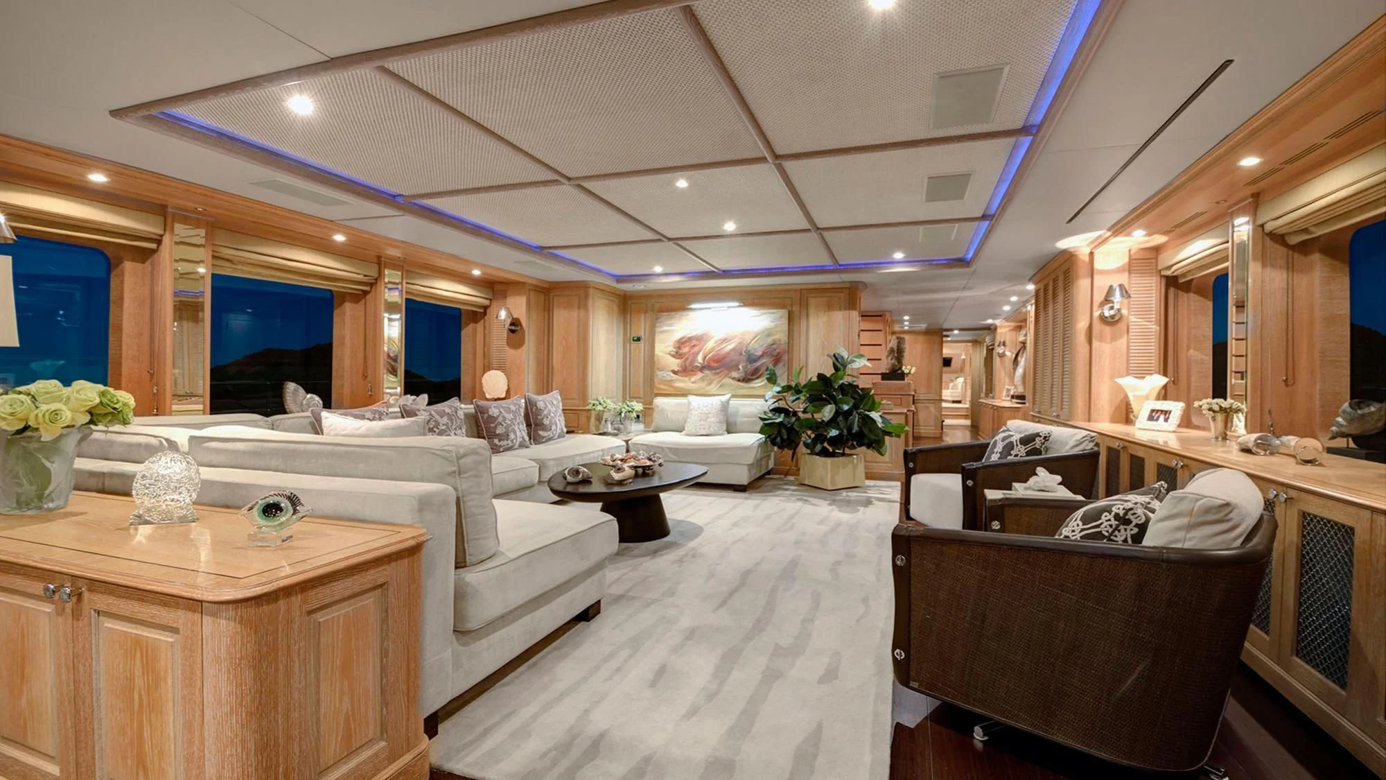 a large living room with a large window aboard QUEST R Yacht for Sale
