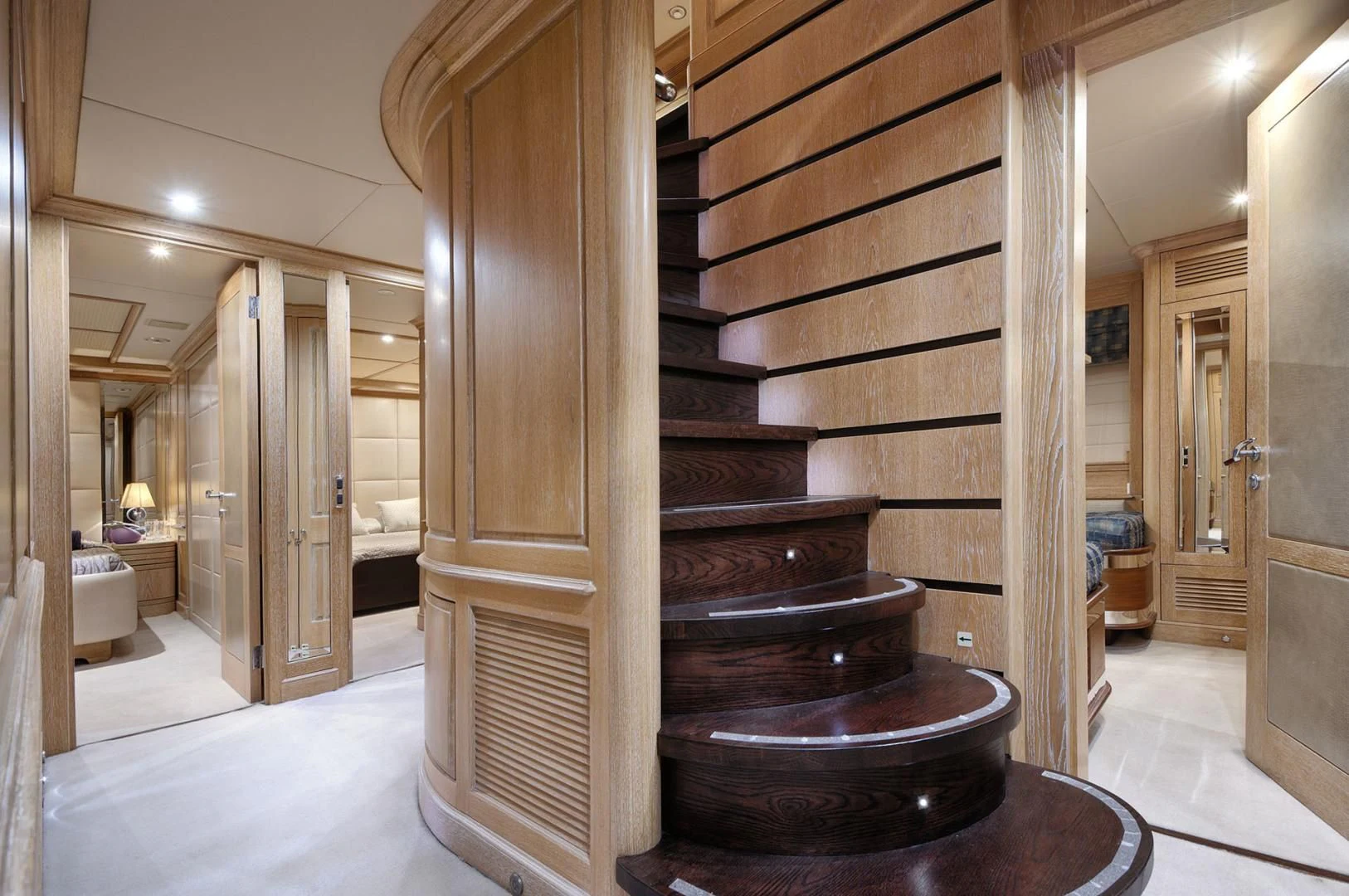 a large wooden staircase aboard QUEST R Yacht for Sale