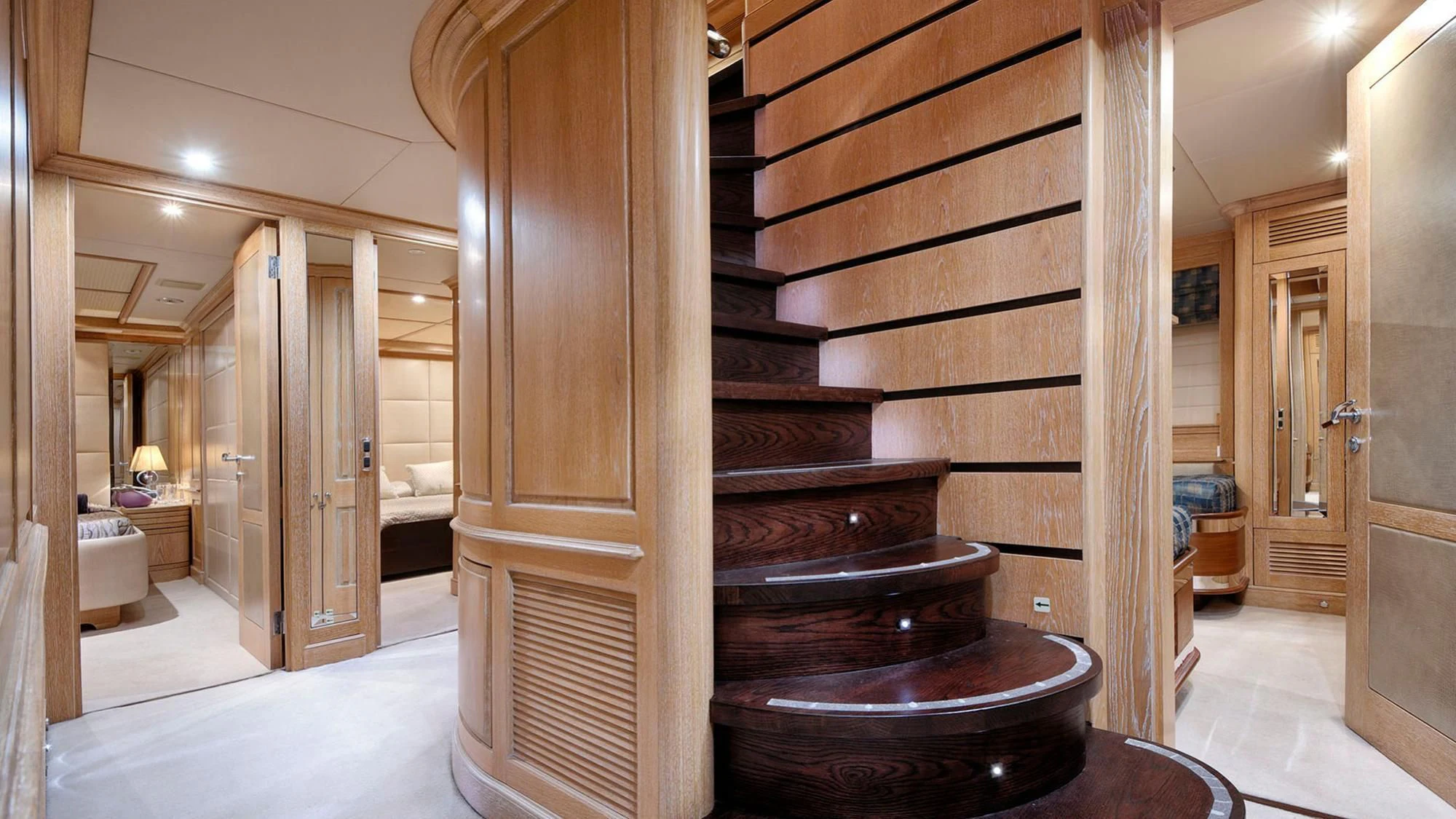 a room with a wood staircase aboard QUEST R Yacht for Sale