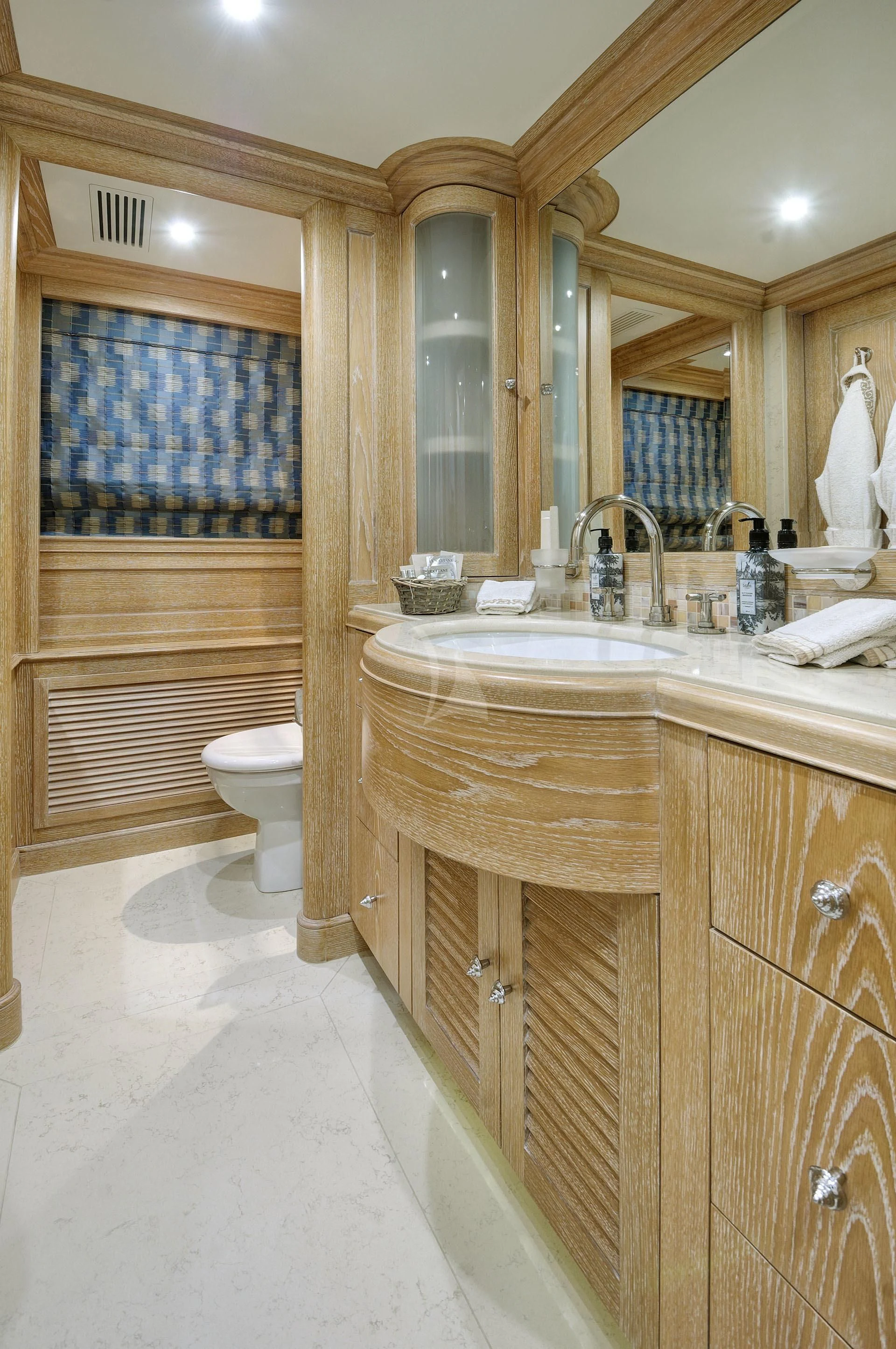 a bathroom with a sink and a toilet aboard QUEST R Yacht for Sale