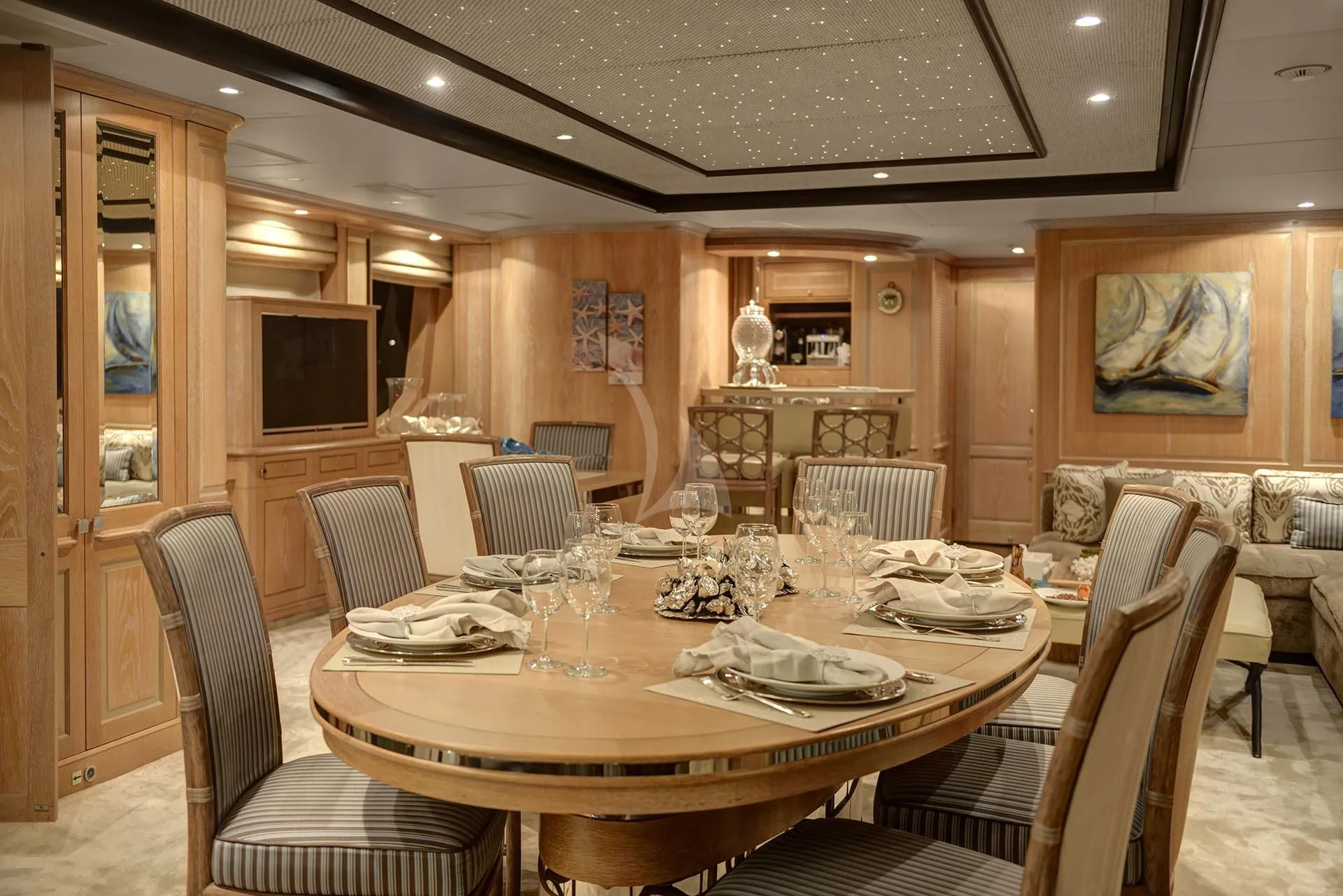 a dining room with a table aboard QUEST R Yacht for Sale