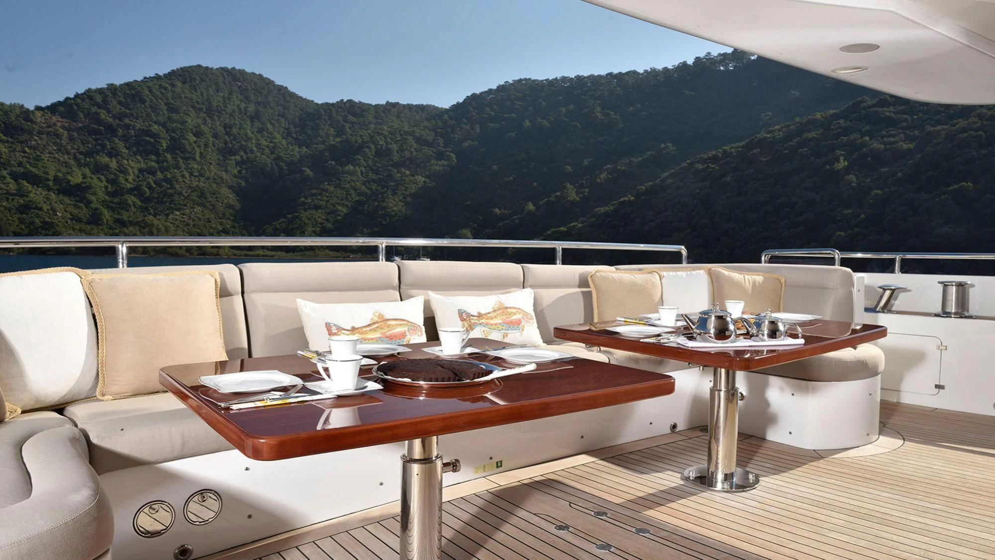 a table on a deck aboard QUEST R Yacht for Sale