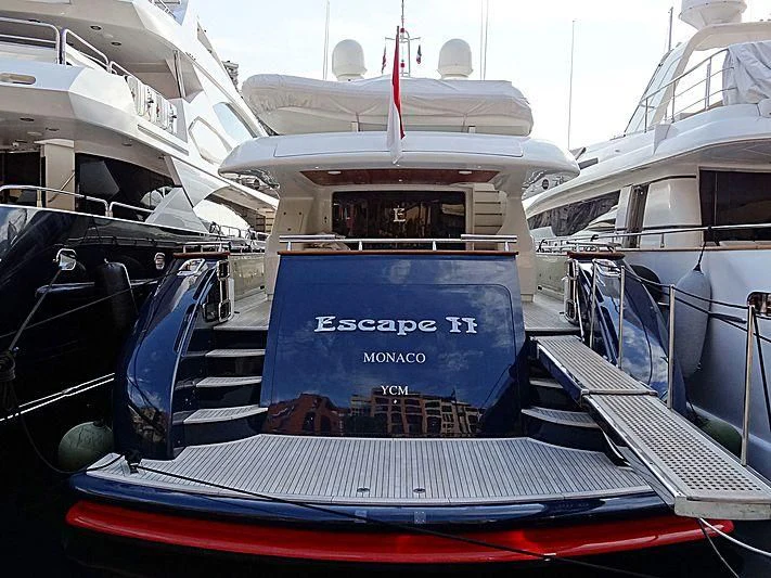 a boat with a sign on the front aboard ESCAPE II Yacht for Sale