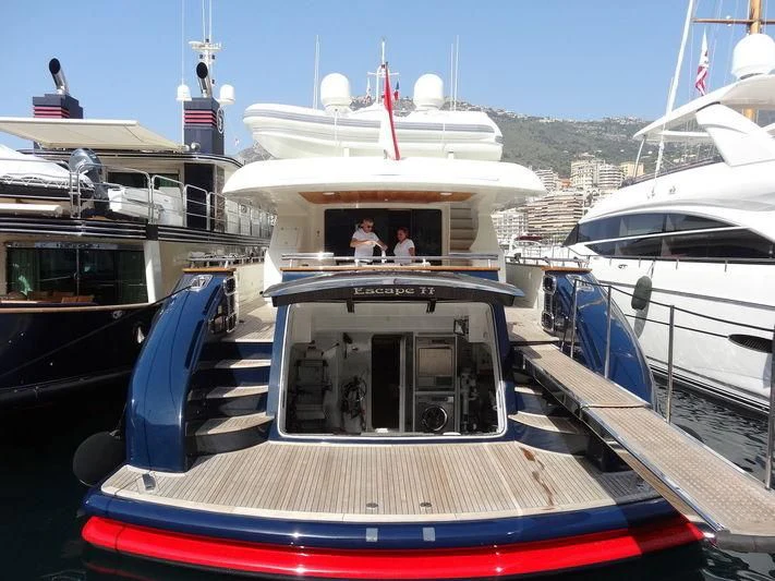 a boat docked at a pier aboard ESCAPE II Yacht for Sale