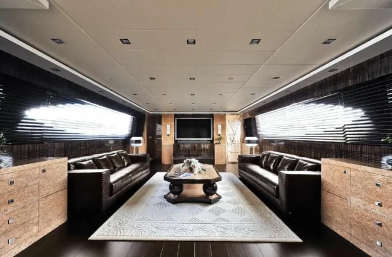 a large room with a couch and a table aboard ESCAPE II Yacht for Sale