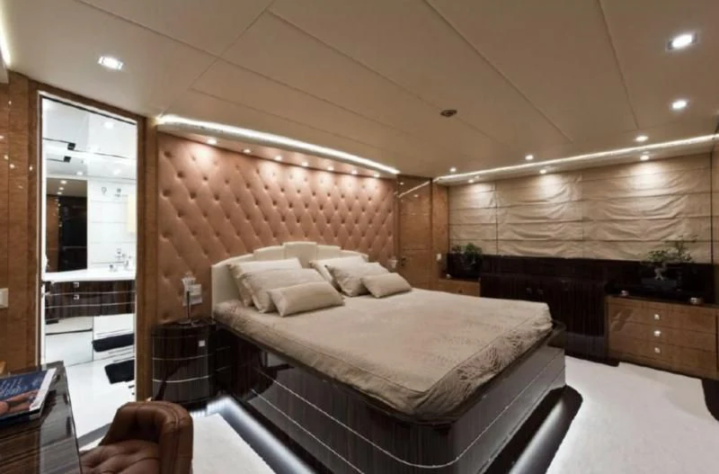 a large bedroom with a bed aboard ESCAPE II Yacht for Sale