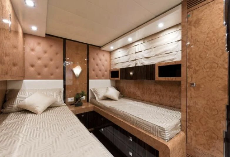 a room with two beds aboard ESCAPE II Yacht for Sale