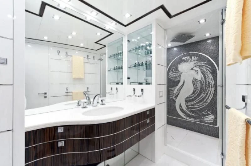 a bathroom with a large mirror aboard ESCAPE II Yacht for Sale