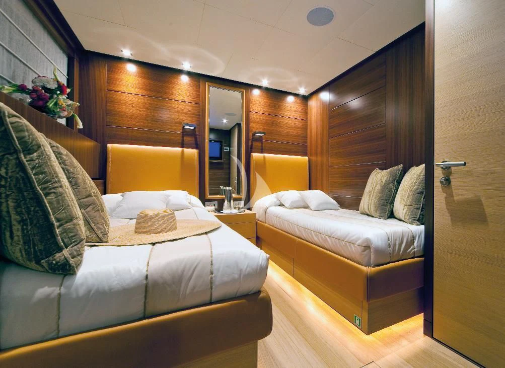 a room with a bed and a mirror aboard SOIREE Yacht for Sale