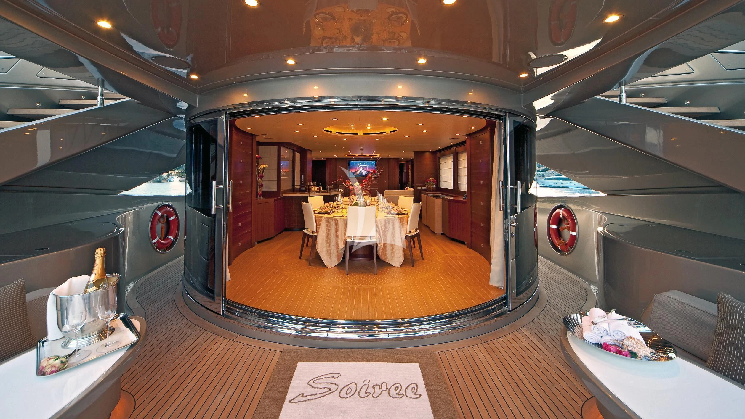 a restaurant with tables and chairs aboard SOIREE Yacht for Sale