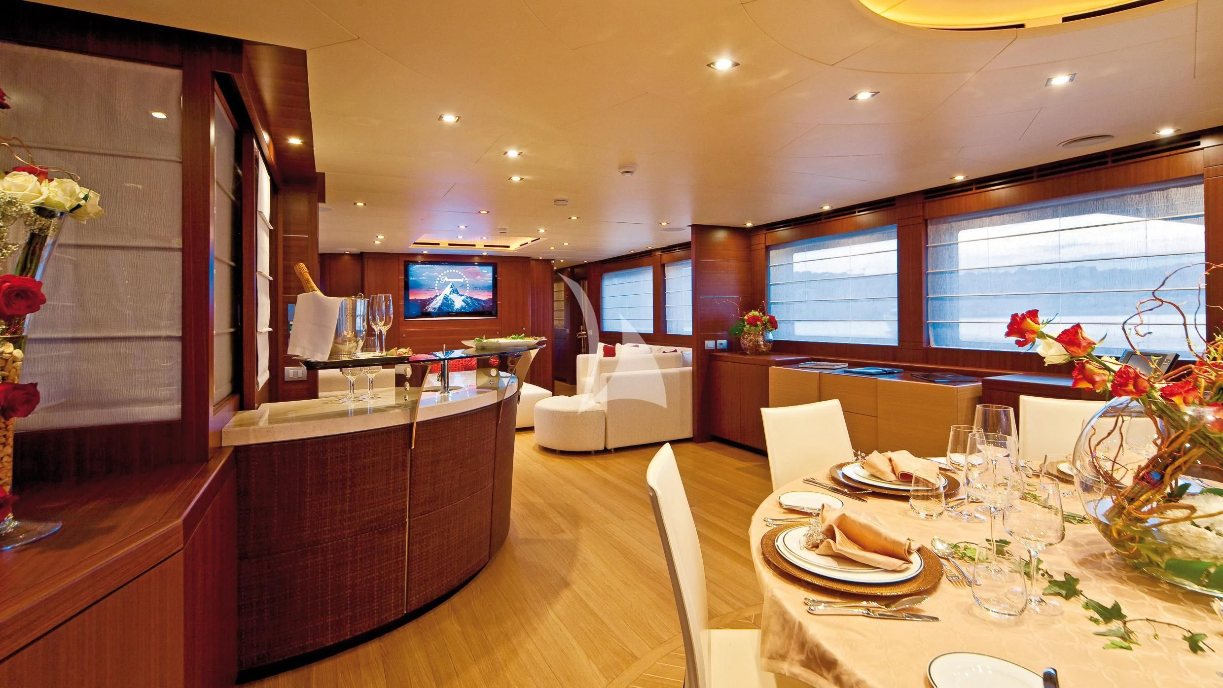 a large kitchen with a dining table aboard SOIREE Yacht for Sale