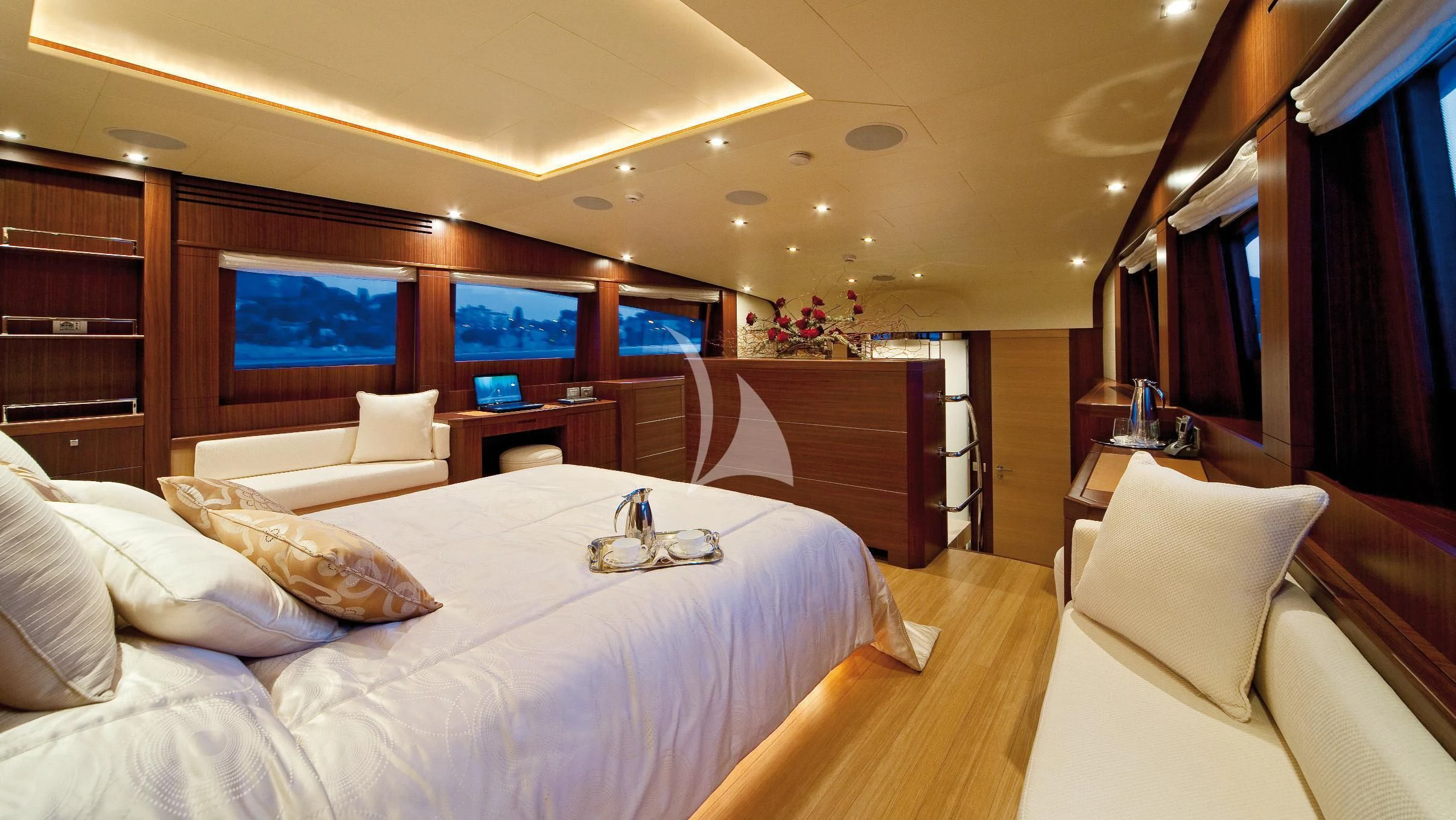 a room with a bed and a television aboard SOIREE Yacht for Sale