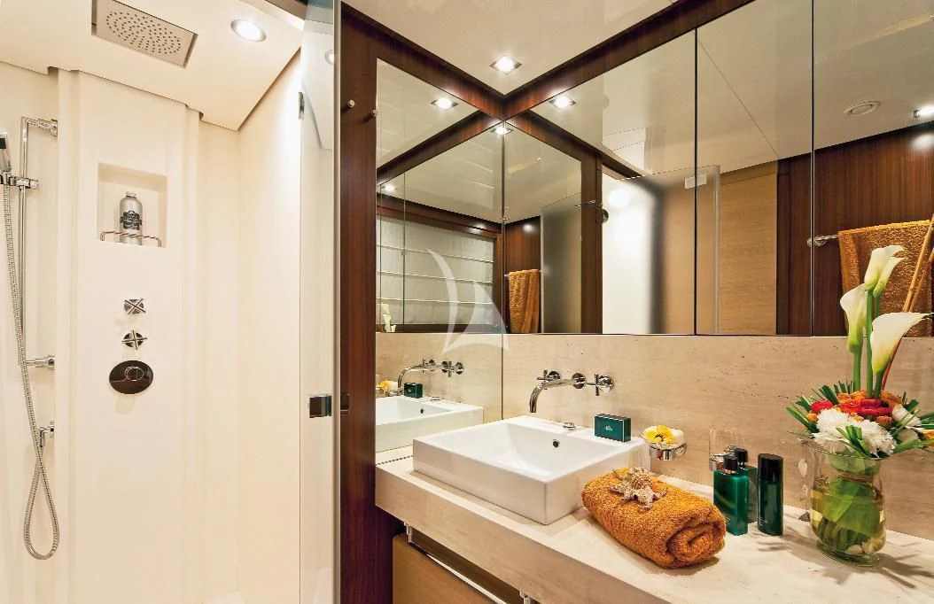 a bathroom with a large mirror aboard SOIREE Yacht for Sale