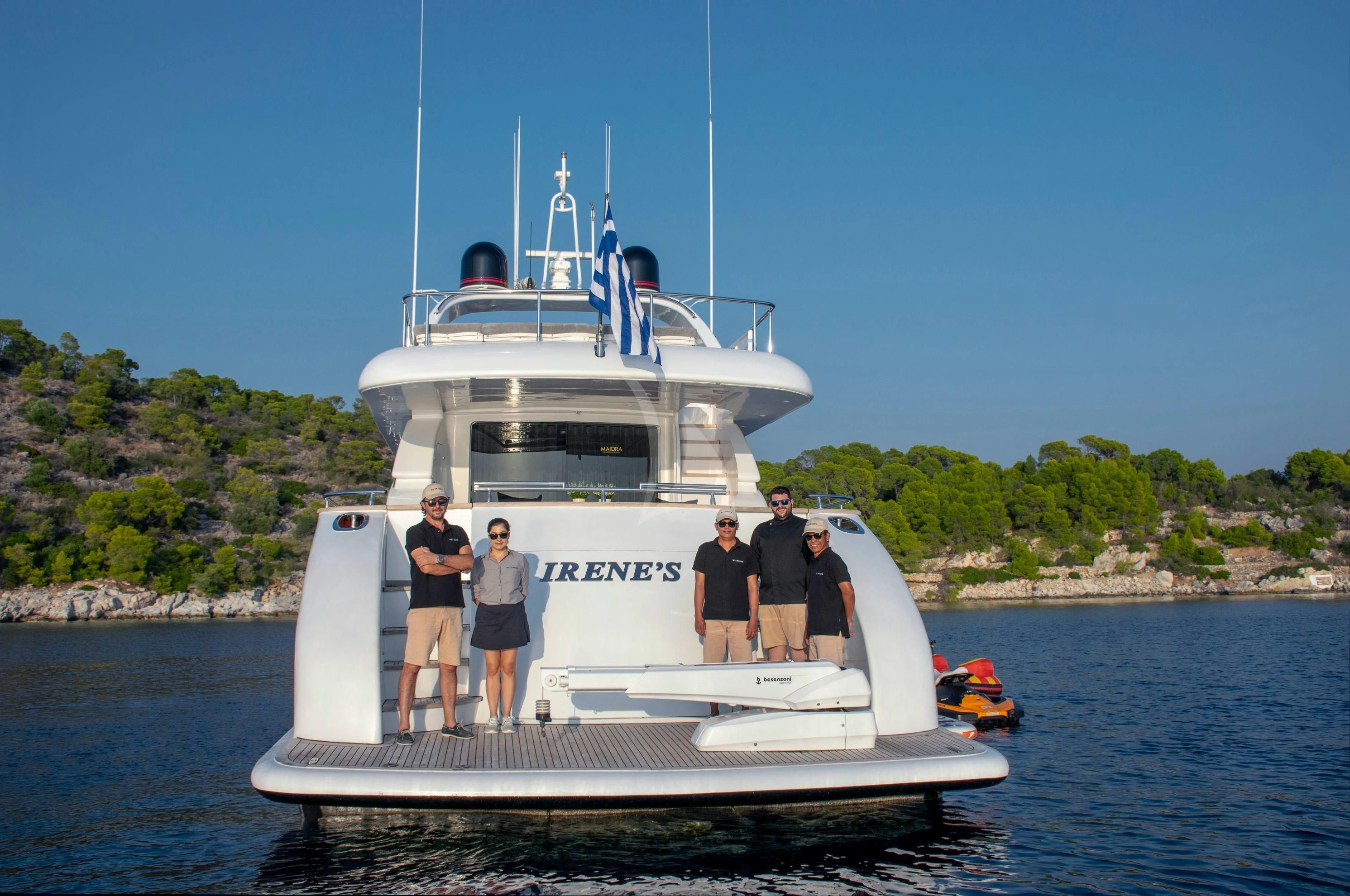 a group of people standing on a boat in the water aboard IRENE'S Yacht for Sale