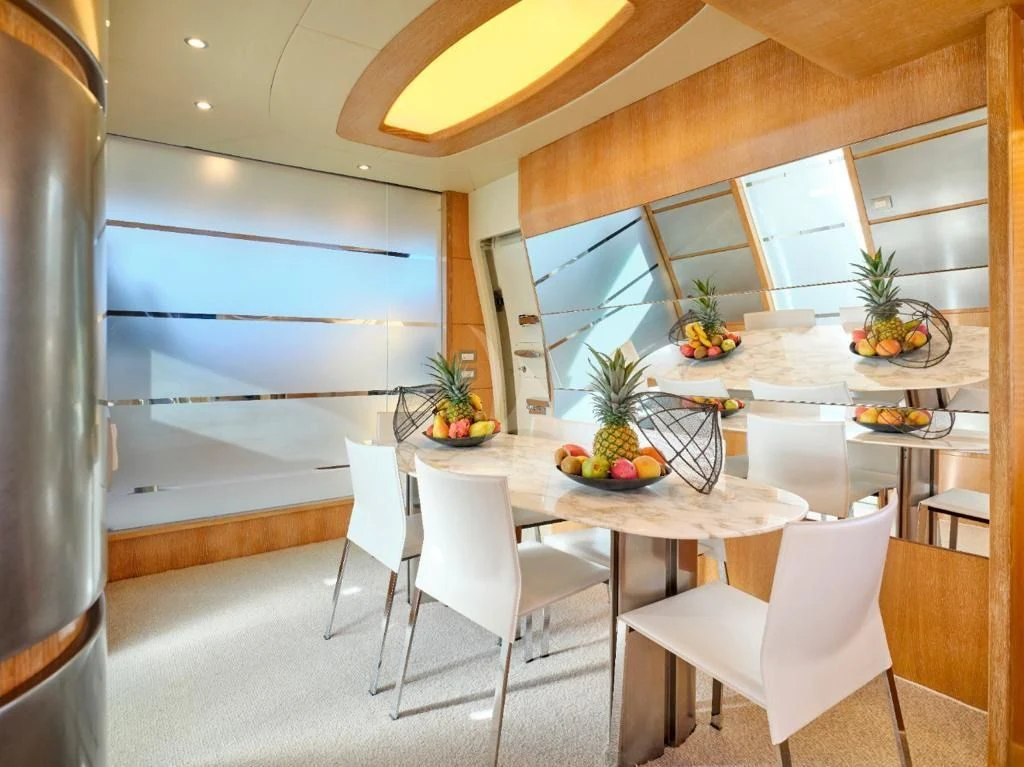 a kitchen with a table and chairs aboard IRENE'S Yacht for Sale