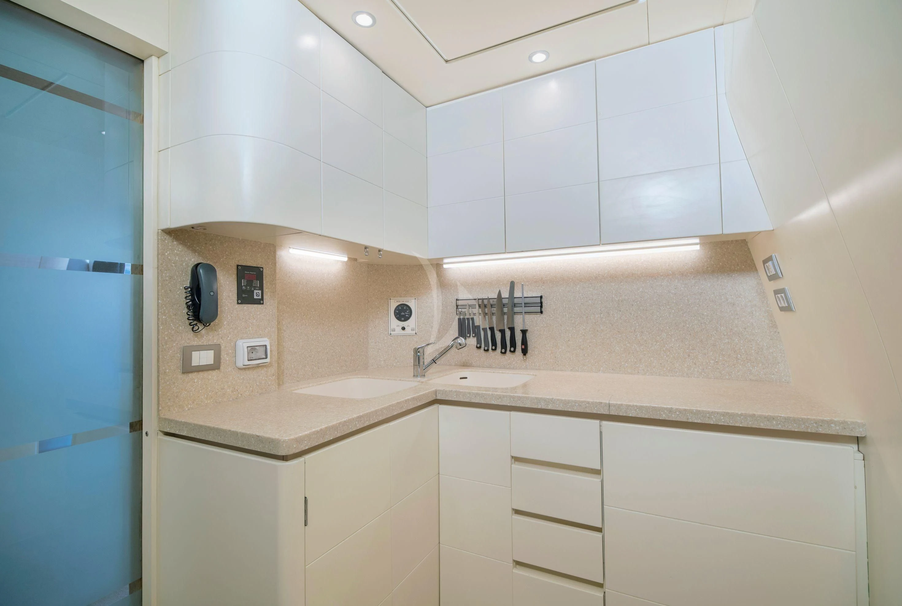 a kitchen with white cabinets aboard IRENE'S Yacht for Sale