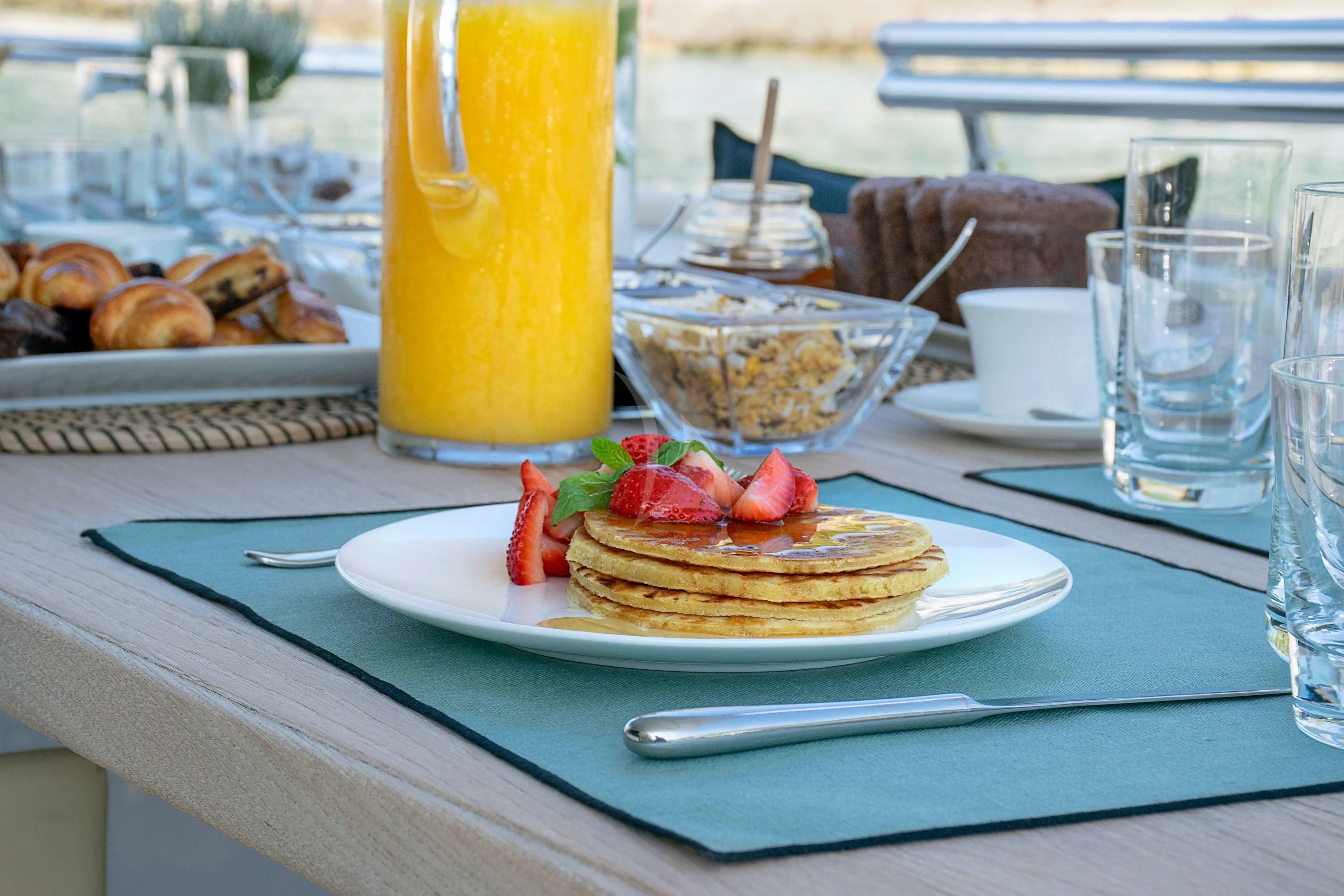 a table with food and drinks aboard IRENE'S Yacht for Sale