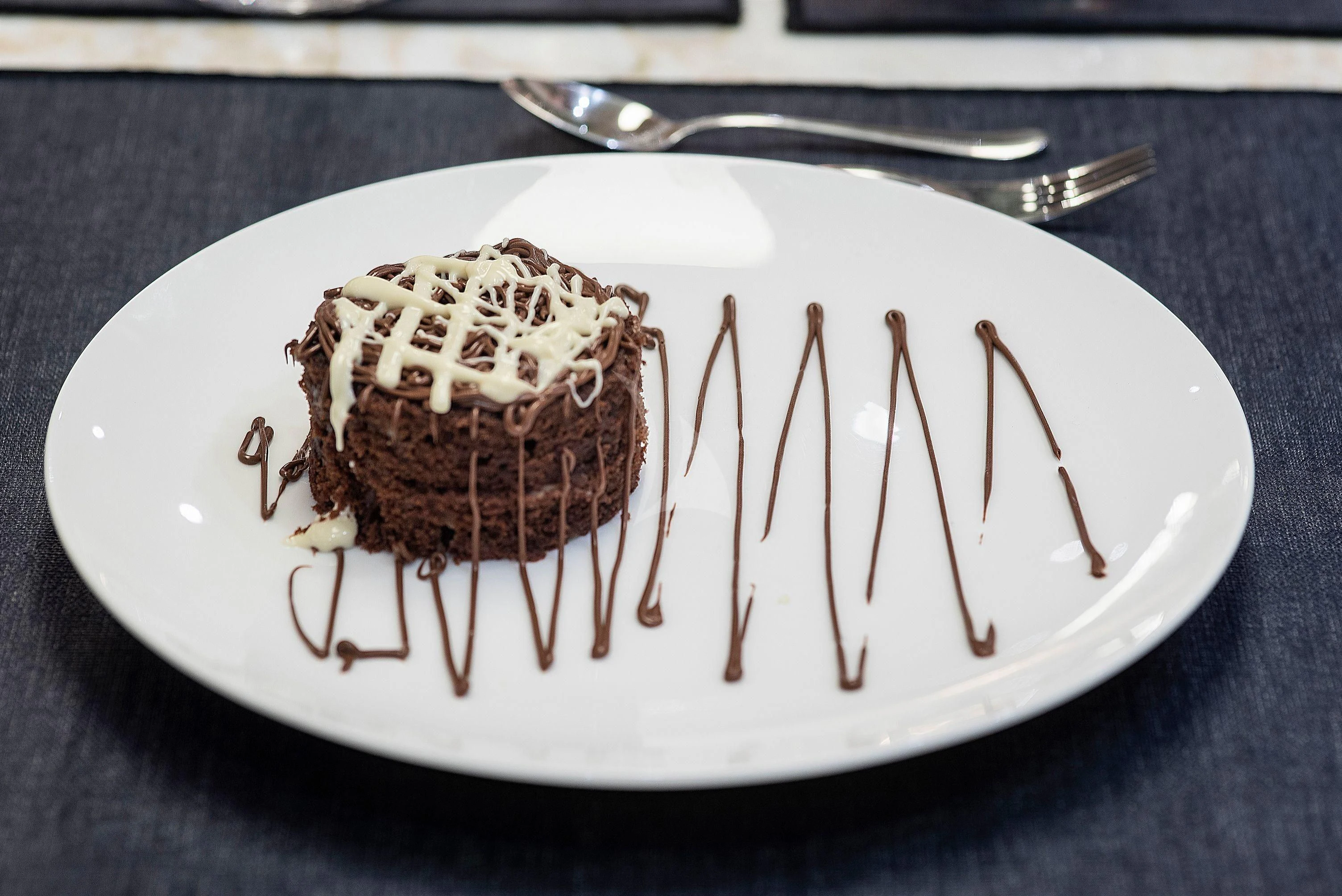 a slice of cake on a plate aboard IRENE'S Yacht for Sale