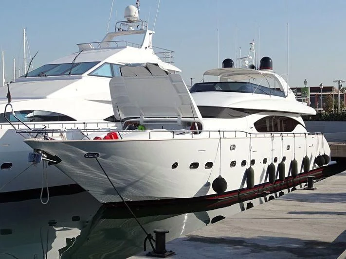 a couple of large white yachts aboard IRENE'S Yacht for Sale