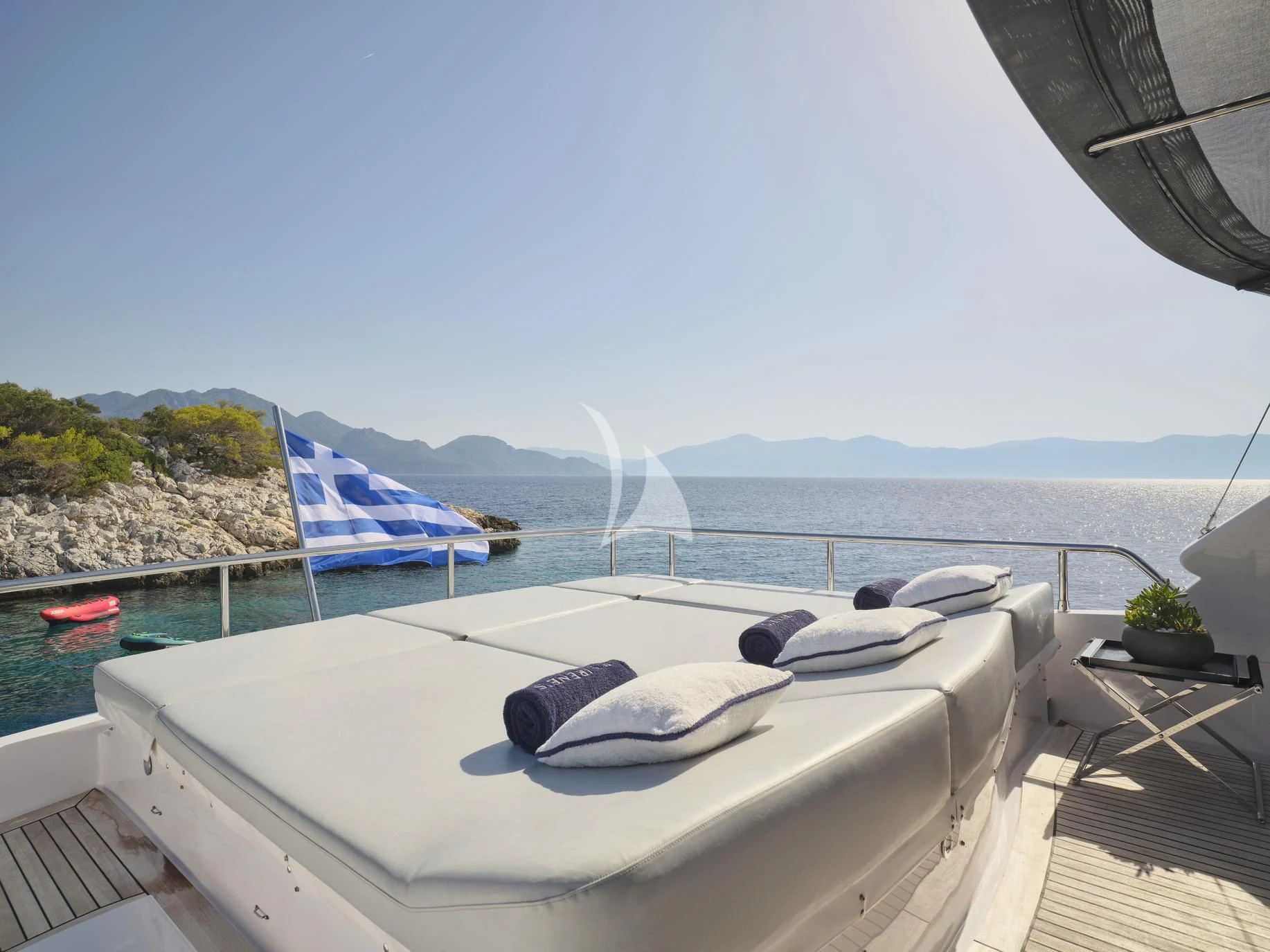 a large white boat on a deck aboard IRENE'S Yacht for Sale