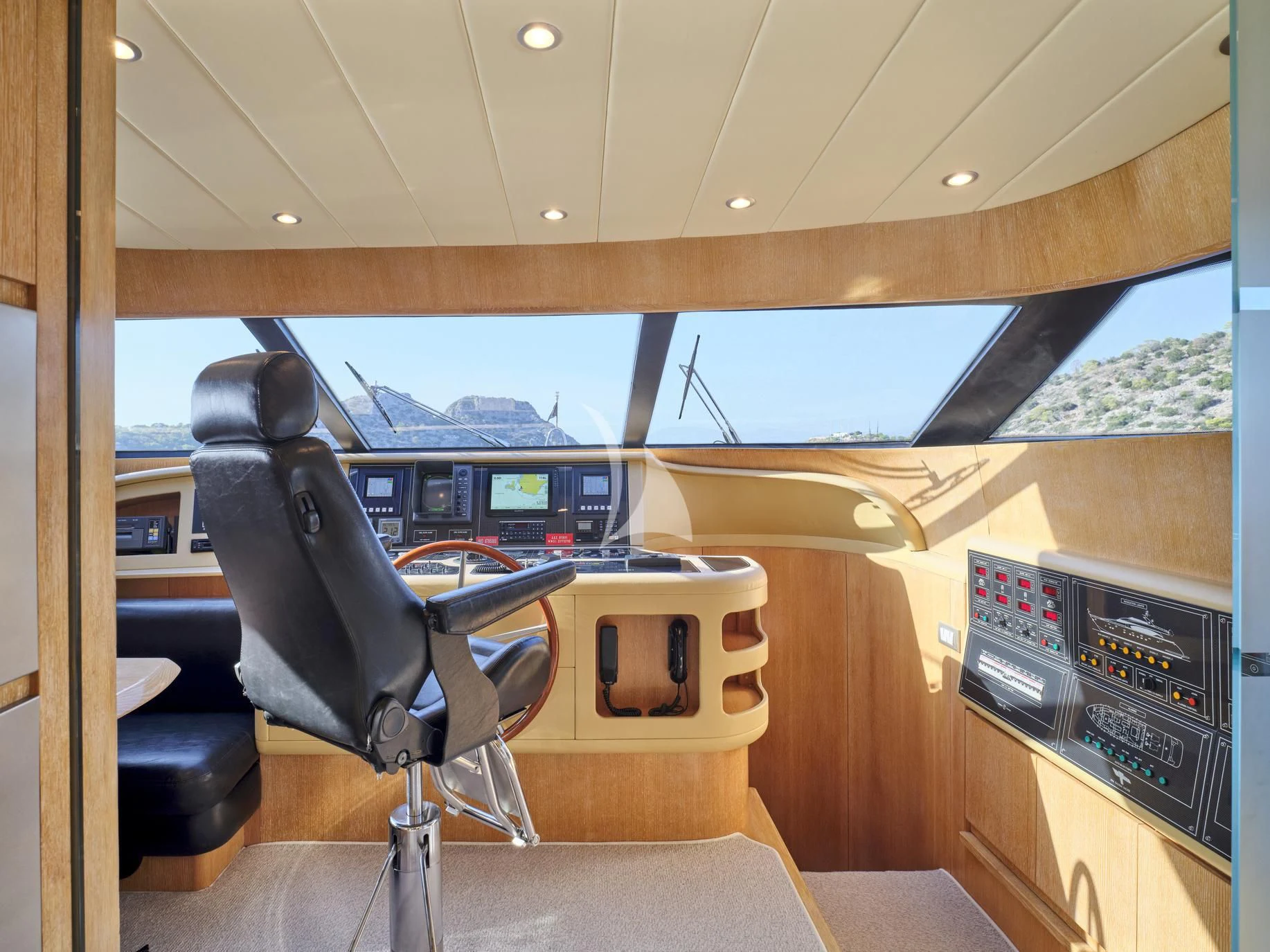 a room with a chair and a table with chairs aboard IRENE'S Yacht for Sale